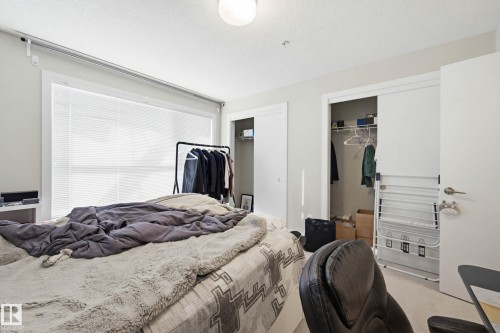Bedroom with two closets and carpet flooring - 90 2560 Pegasus Boulevard, Edmonton, AB - Indoor Photo Showing Bedroom