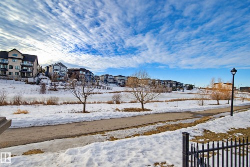 View of yard featuring a residential view - 90 2560 Pegasus Boulevard, Edmonton, AB - Outdoor With View