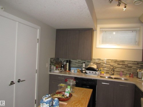 90 2560 Pegasus Boulevard, Edmonton, AB - Indoor Photo Showing Kitchen With Double Sink