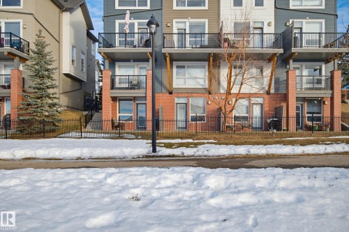 Snow covered building with a view of apartment building / complex - 90 2560 Pegasus Boulevard, Edmonton, AB - Outdoor With Facade
