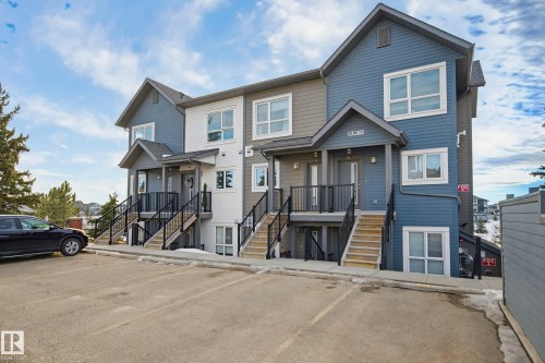 View of front of home with uncovered parking - 90 2560 Pegasus Boulevard, Edmonton, AB - Outdoor With Facade