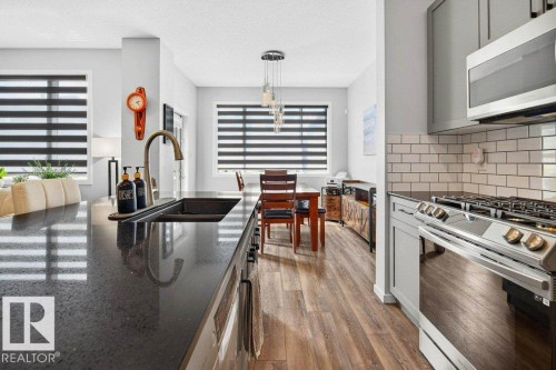 17096 46 Street, Edmonton, AB - Indoor Photo Showing Kitchen With Stainless Steel Kitchen With Double Sink With Upgraded Kitchen