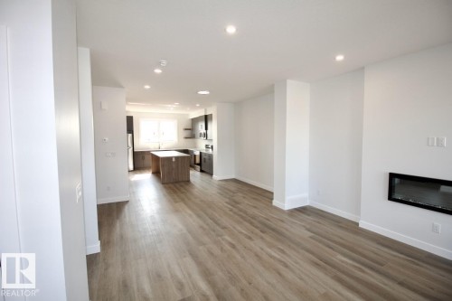 Upper 5803 97A Avenue, Edmonton, AB - Indoor Photo Showing Living Room With Fireplace