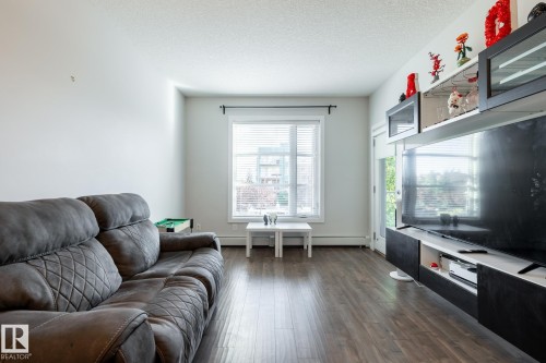 202 2590 Anderson Way, Edmonton, AB - Indoor Photo Showing Living Room