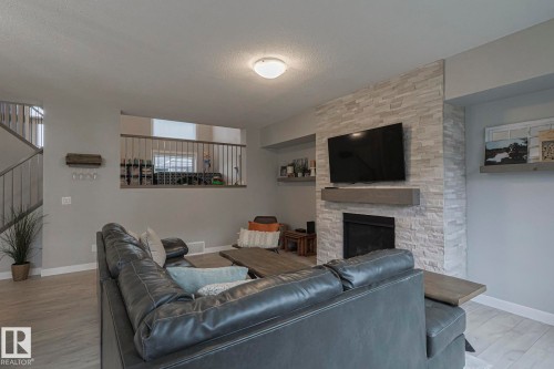 2011 201  St, Edmonton, AB - Indoor Photo Showing Living Room With Fireplace