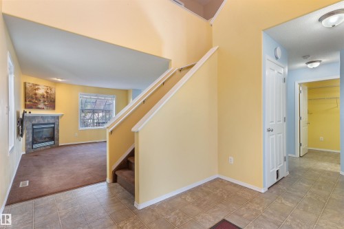 3231 21 Street, Edmonton, AB - Indoor Photo Showing Other Room With Fireplace