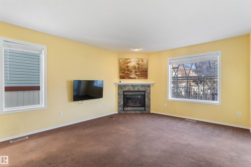 3231 21 Street, Edmonton, AB - Indoor Photo Showing Living Room With Fireplace