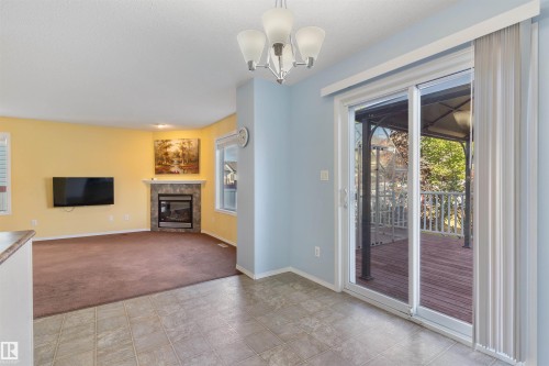 3231 21 Street, Edmonton, AB - Indoor Photo Showing Other Room With Fireplace