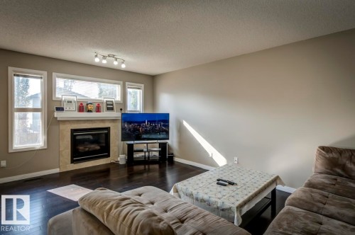 5823 7 Avenue, Edmonton, AB - Indoor Photo Showing Living Room With Fireplace