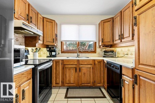 4668 16A Avenue, Edmonton, AB - Indoor Photo Showing Kitchen With Double Sink