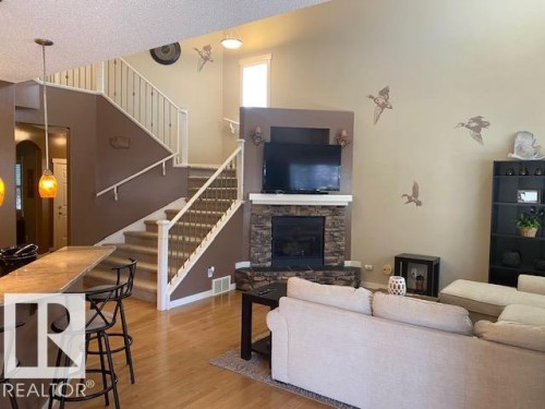 8103 16A Avenue, Edmonton, AB - Indoor Photo Showing Living Room With Fireplace