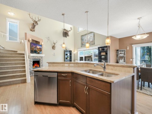 8103 16A Avenue, Edmonton, AB - Indoor Photo Showing Kitchen With Fireplace With Double Sink