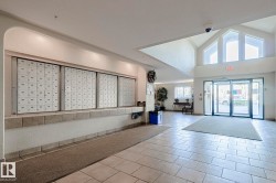 Building lobby with high vaulted ceiling and a textured wall - 