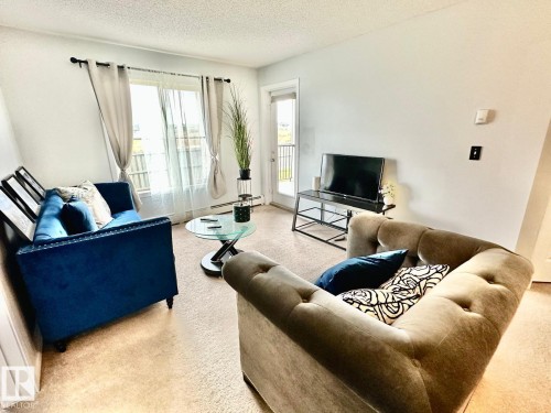 219 5370 Chappelle Road, Edmonton, AB - Indoor Photo Showing Living Room