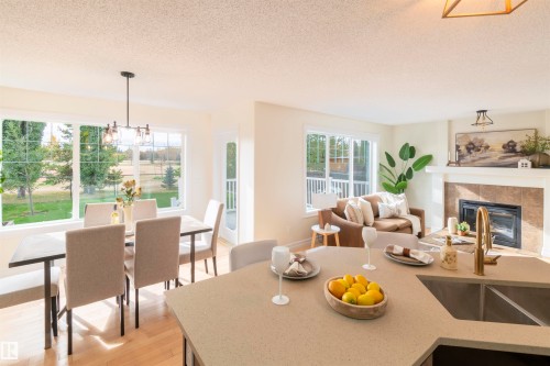 21323 58 Avenue, Edmonton, AB - Indoor Photo Showing Dining Room With Fireplace