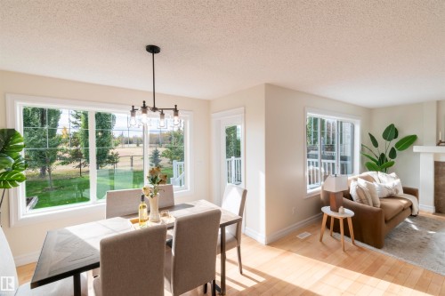 21323 58 Avenue, Edmonton, AB - Indoor Photo Showing Dining Room With Fireplace