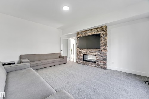 3104 61 Avenue, Rural Leduc County, AB - Indoor Photo Showing Living Room With Fireplace