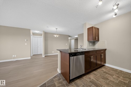 101 5370 Chappelle Road, Edmonton, AB - Indoor Photo Showing Kitchen With Double Sink