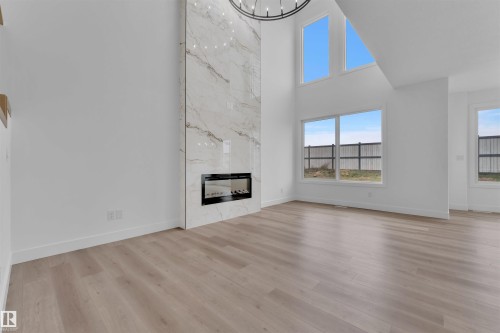 190 Munn Way, Leduc, AB - Indoor Photo Showing Living Room With Fireplace