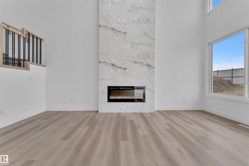 190 Munn Way, Leduc, AB - Indoor Photo Showing Living Room With Fireplace