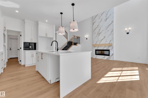 266 Munn Way, Leduc, AB - Indoor Photo Showing Kitchen With Fireplace