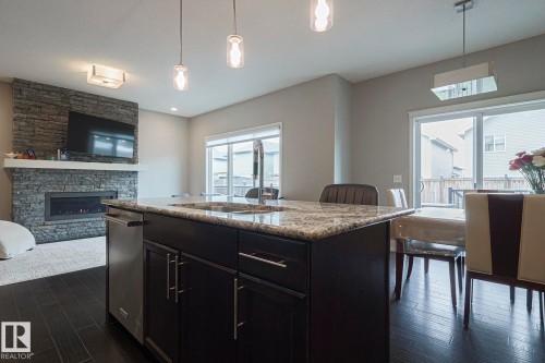 17135 47 Street, Edmonton, AB - Indoor Photo Showing Kitchen With Fireplace