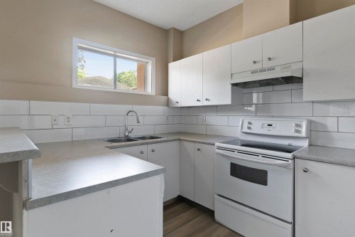 104 10905 109 Street, Edmonton, AB - Indoor Photo Showing Kitchen With Double Sink