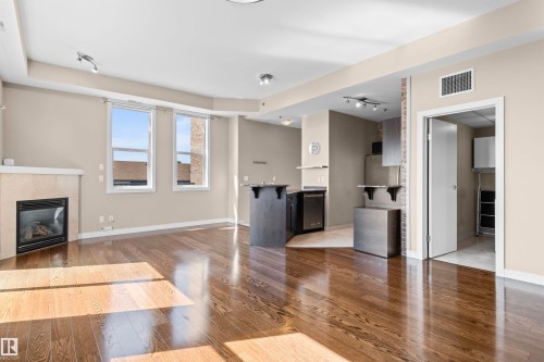 403 8223 99 Street, Edmonton, AB - Indoor Photo Showing Living Room With Fireplace