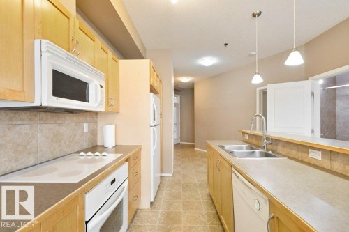 200 4835 104A Street Nw, Edmonton, AB - Indoor Photo Showing Kitchen With Double Sink