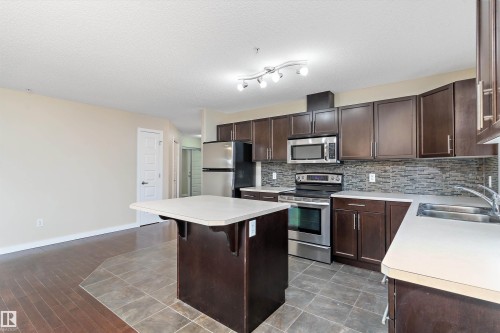 132 11603 Ellerslie Road, Edmonton, AB - Indoor Photo Showing Kitchen With Double Sink