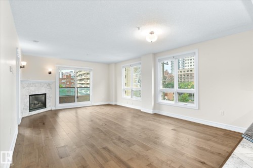 304 10142 111 Street, Edmonton, AB - Indoor Photo Showing Other Room With Fireplace