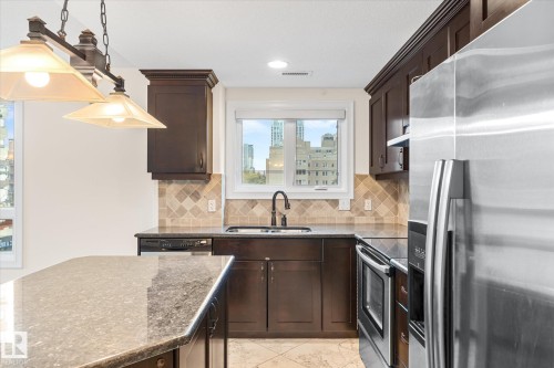 304 10142 111 Street, Edmonton, AB - Indoor Photo Showing Kitchen With Stainless Steel Kitchen With Double Sink With Upgraded Kitchen