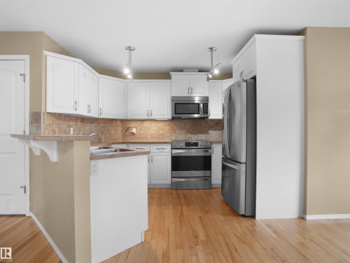 65 Ashby Gardens, Spruce Grove, AB - Indoor Photo Showing Kitchen With Double Sink
