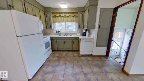 14811 61A Street, Edmonton, AB - Indoor Photo Showing Kitchen With Double Sink