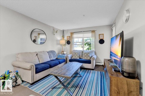 114 11453 Ellerslie Road, Edmonton, AB - Indoor Photo Showing Living Room