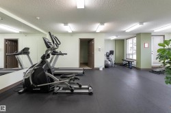 Exercise room featuring a textured ceiling - 