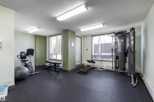 Gym featuring a textured ceiling - 101 6220 134 Avenue, Edmonton, AB - Indoor Photo Showing Gym Room