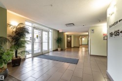 Community lobby featuring a textured ceiling - 