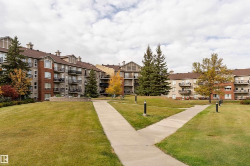 View of property's community with a yard - 101 6220 134 Avenue, Edmonton, AB - Outdoor With Balcony With Facade