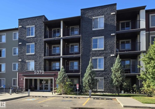 View of apartment building / complex featuring uncovered parking - 404 5370 Chappelle Road, Edmonton, AB - Outdoor With Balcony With Facade