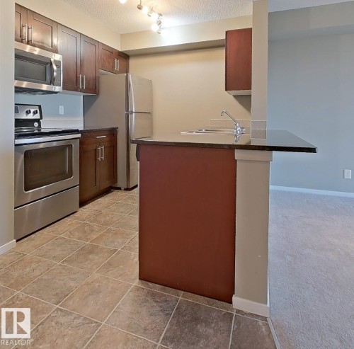 404 5370 Chappelle Road, Edmonton, AB - Indoor Photo Showing Kitchen With Stainless Steel Kitchen