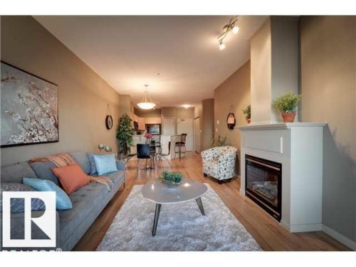 112 4312 139 Avenue, Edmonton, AB - Indoor Photo Showing Living Room With Fireplace