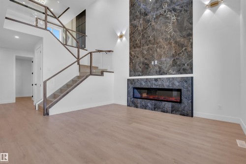 417 Pine Point(E), Leduc, AB - Indoor Photo Showing Other Room With Fireplace