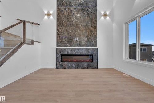 417 Pine Point(E), Leduc, AB - Indoor Photo Showing Living Room With Fireplace