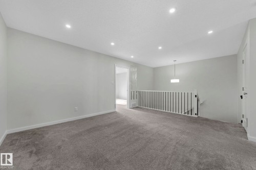 Empty room with carpet, recessed lighting, and a textured ceiling - 1813 Collip View View, Edmonton, AB - Indoor Photo Showing Other Room
