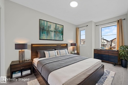 Bedroom with carpet floors - 1813 Collip View View, Edmonton, AB - Indoor Photo Showing Bedroom