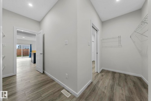 Corridor featuring recessed lighting and light wood-style floors - 1813 Collip View View, Edmonton, AB - Indoor Photo Showing Other Room