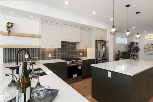 7505 Rowland Road, Edmonton, AB - Indoor Photo Showing Kitchen With Stainless Steel Kitchen With Upgraded Kitchen