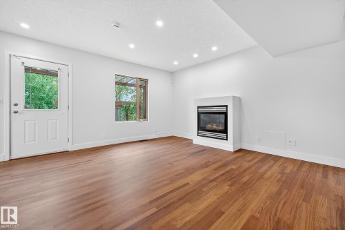 8860 93 Street, Edmonton, AB - Indoor Photo Showing Living Room With Fireplace