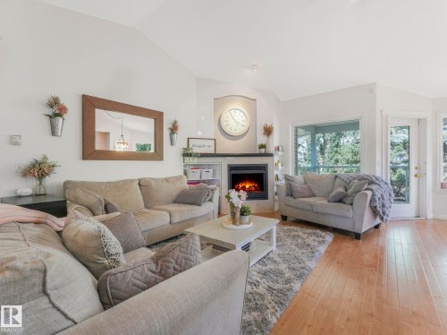 138 Pipestone Manor, Millet, AB - Indoor Photo Showing Living Room With Fireplace